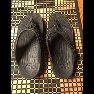 Pair of Crocs glitter sandals